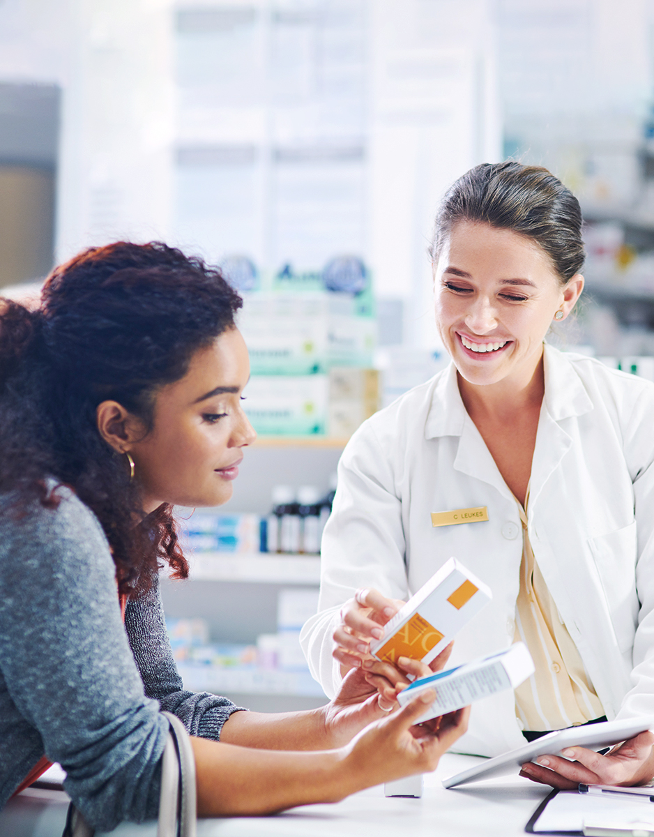 Pharmacist with patient